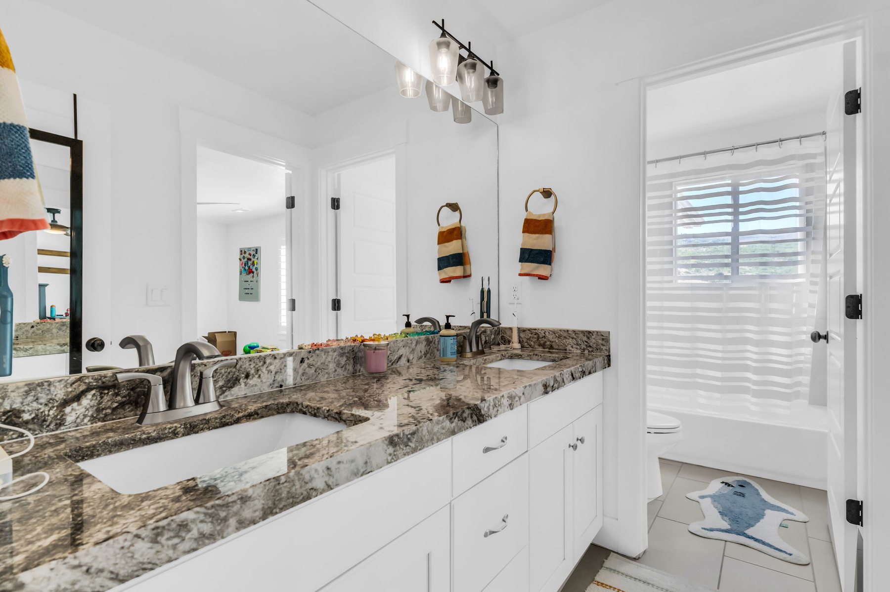 Bathroom with granite vanity at 12517 N Minots Ledge Dr